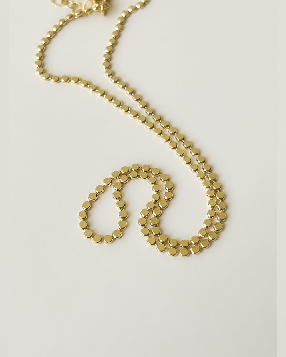 Gold filled flat bead chain necklace close-up
