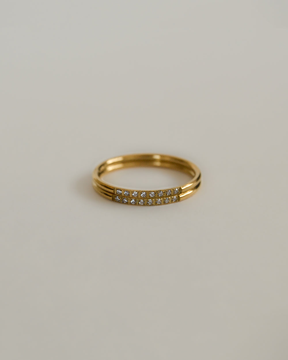 Close-up for two thin dainty rings with pave detail