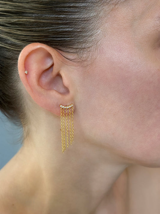 Statement Bold fringe chain earrings in 14K gold-coated sterling silver on model's ear