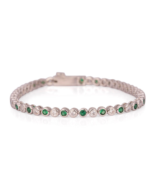 Close-up of emerald and cubic zirconia tennis bracelet