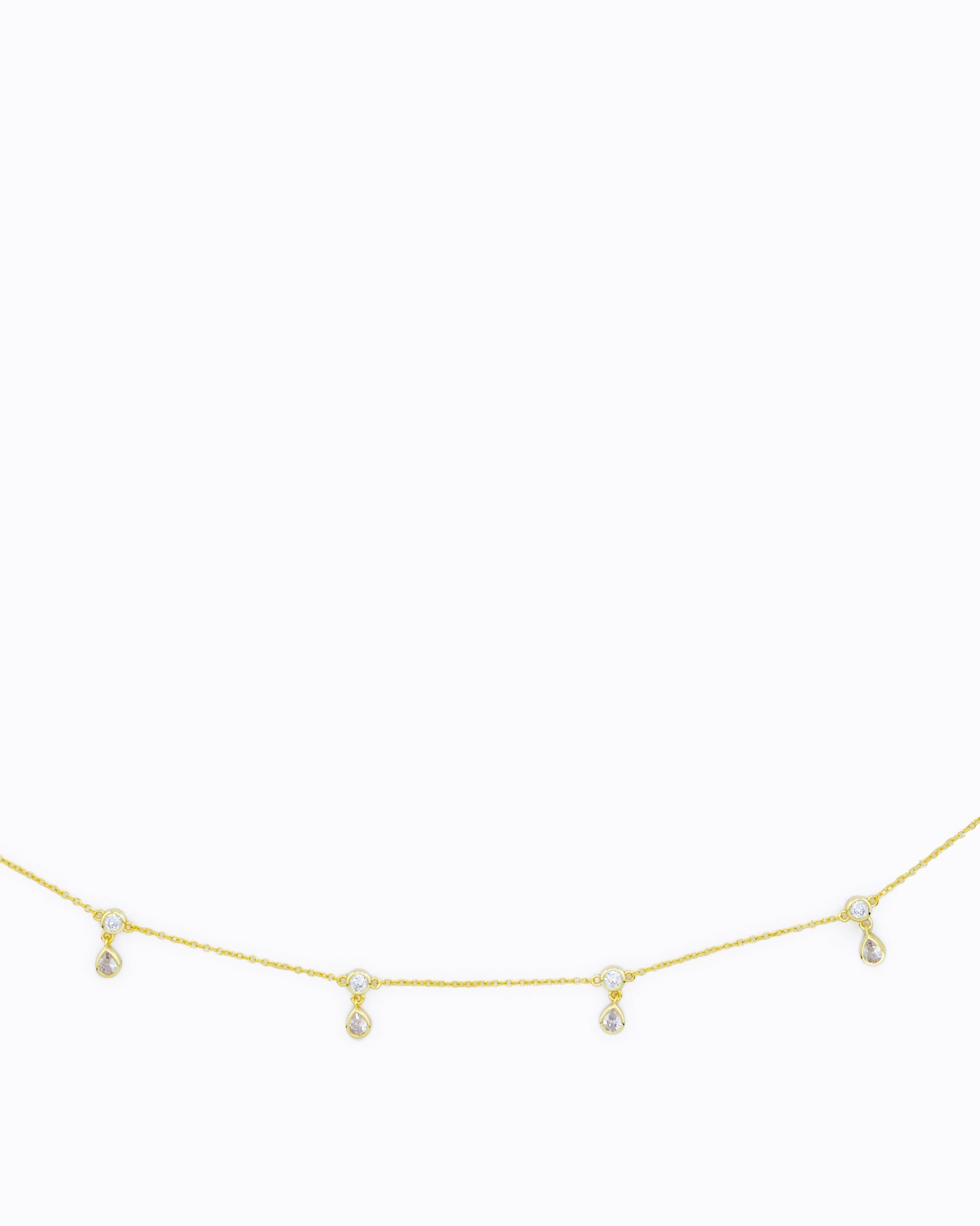 Close up of 14k gold vermeil belly chain with CZ droplet accents