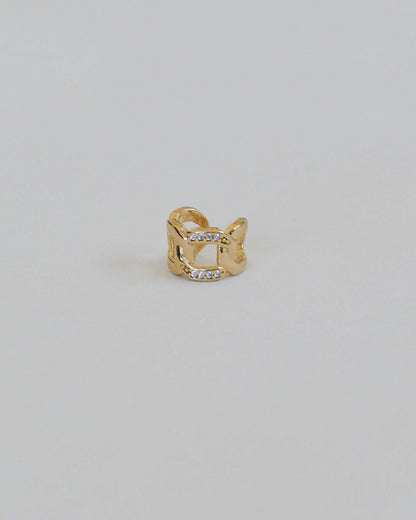 18K gold-filled ear cuff with chain design and sparkling stones close-up