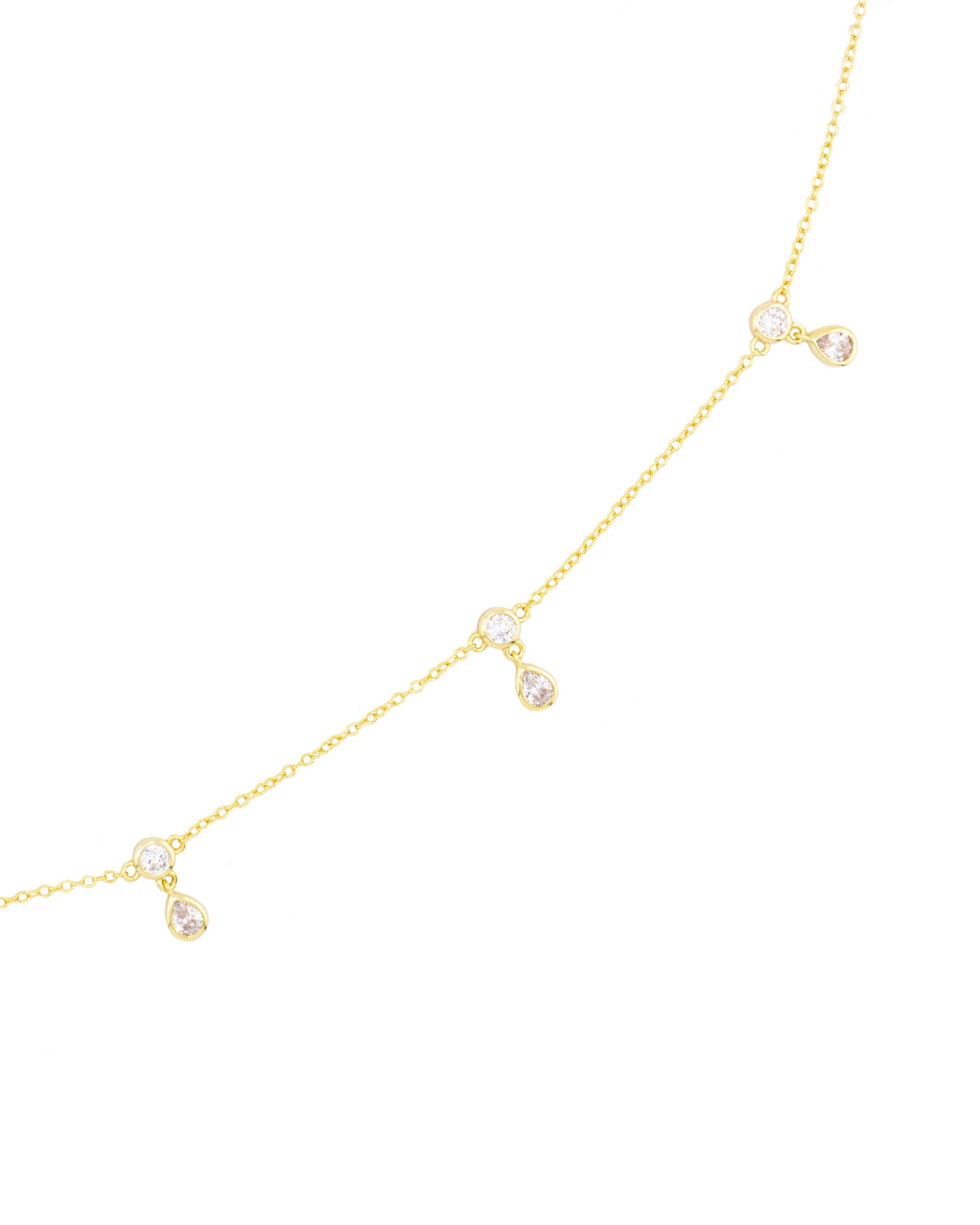 Close up of 14k gold vermeil belly chain with CZ droplet accents